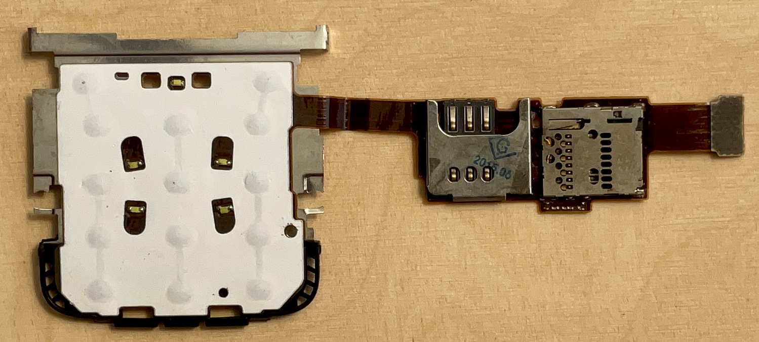 Deska klávesnice a čtečka SIM a MMC pro Nokia C3-00